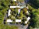 Aerial view of the community highlighting the building's layout, greenery, pool and parking at 1261 Lavista Rd # C3, Atlanta, GA 30324