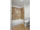 Bathroom featuring stylish tile, shower, and bath at 1261 Lavista Rd # C3, Atlanta, GA 30324