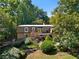 Exterior showcasing beautiful landscaping, trees, and the house at 1261 Lavista Rd # C3, Atlanta, GA 30324