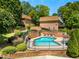 Pool area with lounge chairs surrounded by fencing at 1261 Lavista Rd # C3, Atlanta, GA 30324