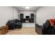Finished basement providing entertainment space with a leather sectional and media center at 1988 Claiborne Ct, Marietta, GA 30062