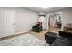 Basement area with neutral walls and new flooring, adjacent to a work area and office at 1988 Claiborne Ct, Marietta, GA 30062