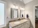 Bathroom featuring double sinks, granite counters, and bright lighting at 1988 Claiborne Ct, Marietta, GA 30062