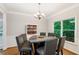 Elegant dining room with hardwood floors, a chandelier, and natural light from the windows at 1988 Claiborne Ct, Marietta, GA 30062
