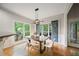 Elegant dining room with hardwood floors, modern light fixture, and natural light at 1988 Claiborne Ct, Marietta, GA 30062