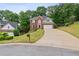 Charming two-story brick home with well-manicured lawn and a long driveway at 1988 Claiborne Ct, Marietta, GA 30062