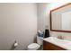 Convenient half bathroom featuring a vanity with sink, toilet, and mirror at 1988 Claiborne Ct, Marietta, GA 30062