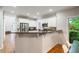 Bright kitchen featuring white cabinets, stainless steel appliances, and granite countertops at 1988 Claiborne Ct, Marietta, GA 30062