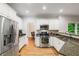 Well-lit kitchen boasting stainless steel appliances and granite counters at 1988 Claiborne Ct, Marietta, GA 30062