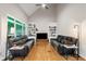Bright living room with vaulted ceilings, fireplace, hardwood floors, and built-in shelving at 1988 Claiborne Ct, Marietta, GA 30062