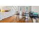 Spacious home office area with hardwood floors, large desk, and abundant natural light at 1988 Claiborne Ct, Marietta, GA 30062