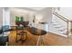 Office area with a large desk, hardwood floors, and staircase access at 1988 Claiborne Ct, Marietta, GA 30062