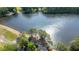 An aerial view of a home on a lakefront property, showcasing lush trees and waterfront access at 2495 Northlake Ne Ct, Atlanta, GA 30345