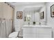 Bright bathroom featuring a double sink vanity, stylish shower curtain and artistic wall decor at 2495 Northlake Ne Ct, Atlanta, GA 30345