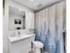Clean bathroom design with tree-themed shower curtain, modern vanity, and neutral tones at 2495 Northlake Ne Ct, Atlanta, GA 30345