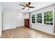 Bright bedroom with hardwood floors and a scenic view from the multiple windows at 2495 Northlake Ne Ct, Atlanta, GA 30345