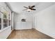 Bright bedroom featuring hardwood floors, a modern ceiling fan and multiple windows at 2495 Northlake Ne Ct, Atlanta, GA 30345