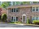 Charming brick townhome with updated windows, shutters, tidy landscaping and inviting front entrance at 2495 Northlake Ne Ct, Atlanta, GA 30345