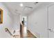 Bright hallway leads to other rooms, featuring hardwood floors and a staircase at 2495 Northlake Ne Ct, Atlanta, GA 30345