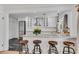 Modern kitchen boasts sleek countertops, stainless steel appliances, and stylish bar stool seating at 2495 Northlake Ne Ct, Atlanta, GA 30345