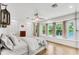 Sunlit main bedroom with large windows, neutral decor, and hardwood flooring at 2495 Northlake Ne Ct, Atlanta, GA 30345