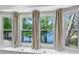 Close up view of window seats providing panoramic views of lake and trees at 2495 Northlake Ne Ct, Atlanta, GA 30345