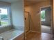 Bathroom with separate shower and tub, plus a street view out the window at 4120 Chapel Hill Reserve, Douglasville, GA 30135