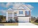 Charming two-story home with a welcoming double porch, a beautiful stone facade, and an attached two-car garage at 4120 Chapel Hill Reserve, Douglasville, GA 30135
