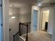 Second floor hallway with neutral carpet and lighting at 4120 Chapel Hill Reserve, Douglasville, GA 30135