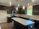 Modern kitchen with stainless steel appliances, granite countertops, and a large island at 4120 Chapel Hill Reserve, Douglasville, GA 30135