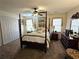 Elegant bedroom with a four-poster bed, neutral walls, and double closet providing ample storage at 4409 Deborahs Ct # 0, Union City, GA 30291