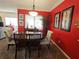 Bright dining room features a round table, four chairs, red walls, and natural light at 4409 Deborahs Ct # 0, Union City, GA 30291