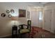Inviting home foyer featuring a decorative rug, chair, and a view of the front door and sidelight at 4409 Deborahs Ct # 0, Union City, GA 30291