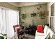 Charming sun room filled with natural light, plants, and cozy seating at 4409 Deborahs Ct # 0, Union City, GA 30291