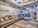 Finished basement featuring laminate floors, ductwork, and comfortable seating area at 4579 Amberly S Ct, Atlanta, GA 30360