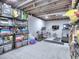 Unfinished basement area including shelving with equipment and organization at 4579 Amberly S Ct, Atlanta, GA 30360