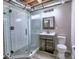 Updated bathroom with a glass shower, modern vanity, and tile flooring at 4579 Amberly S Ct, Atlanta, GA 30360