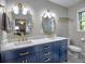 Beautiful bathroom with double vanity, gold hardware, marble countertop, and stylish mirrors at 4579 Amberly S Ct, Atlanta, GA 30360