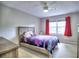 Bright bedroom with carpet, natural light, and a comfortable bed with colorful decor at 4579 Amberly S Ct, Atlanta, GA 30360
