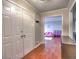 Inviting entryway with hardwood floors, closet space, and view into a charming living room at 4579 Amberly S Ct, Atlanta, GA 30360