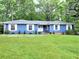Charming single-story home with a well-manicured lawn, white shutters, and a welcoming double-door entrance at 4579 Amberly S Ct, Atlanta, GA 30360