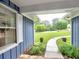 Inviting front porch with landscaped garden and walkway leading to the main house at 4579 Amberly S Ct, Atlanta, GA 30360