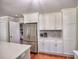 Kitchen showcasing stainless steel refrigerator, modern cabinets, and sleek countertops at 4579 Amberly S Ct, Atlanta, GA 30360