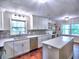 Bright kitchen with white cabinetry, stainless steel appliances, and center island at 4579 Amberly S Ct, Atlanta, GA 30360