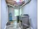 Clean laundry room featuring modern washer and dryer with gray walls and wood floors at 4579 Amberly S Ct, Atlanta, GA 30360