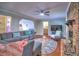 Bright living room offering a brick fireplace, modern decor, and ample seating at 4579 Amberly S Ct, Atlanta, GA 30360