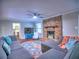 Relaxing living room showcasing a brick fireplace, plush sofa, and inviting round rug at 4579 Amberly S Ct, Atlanta, GA 30360