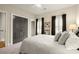 Inviting bedroom with plush carpeting and elegant window shutters at 719 Hammond Dr, Woodstock, GA 30188