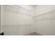 Walk-in closet has a customizable wire shelving system, maximizing storage space at 719 Hammond Dr, Woodstock, GA 30188
