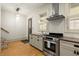 Kitchen featuring stainless steel appliances, granite countertops, and hardwood flooring at 719 Hammond Dr, Woodstock, GA 30188
